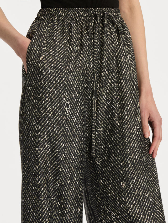 Black and Ivory Chevron Silk Twill Drawstring Pant featuring a high elastic waistband and fluid, shimmering drape. Zoom View.