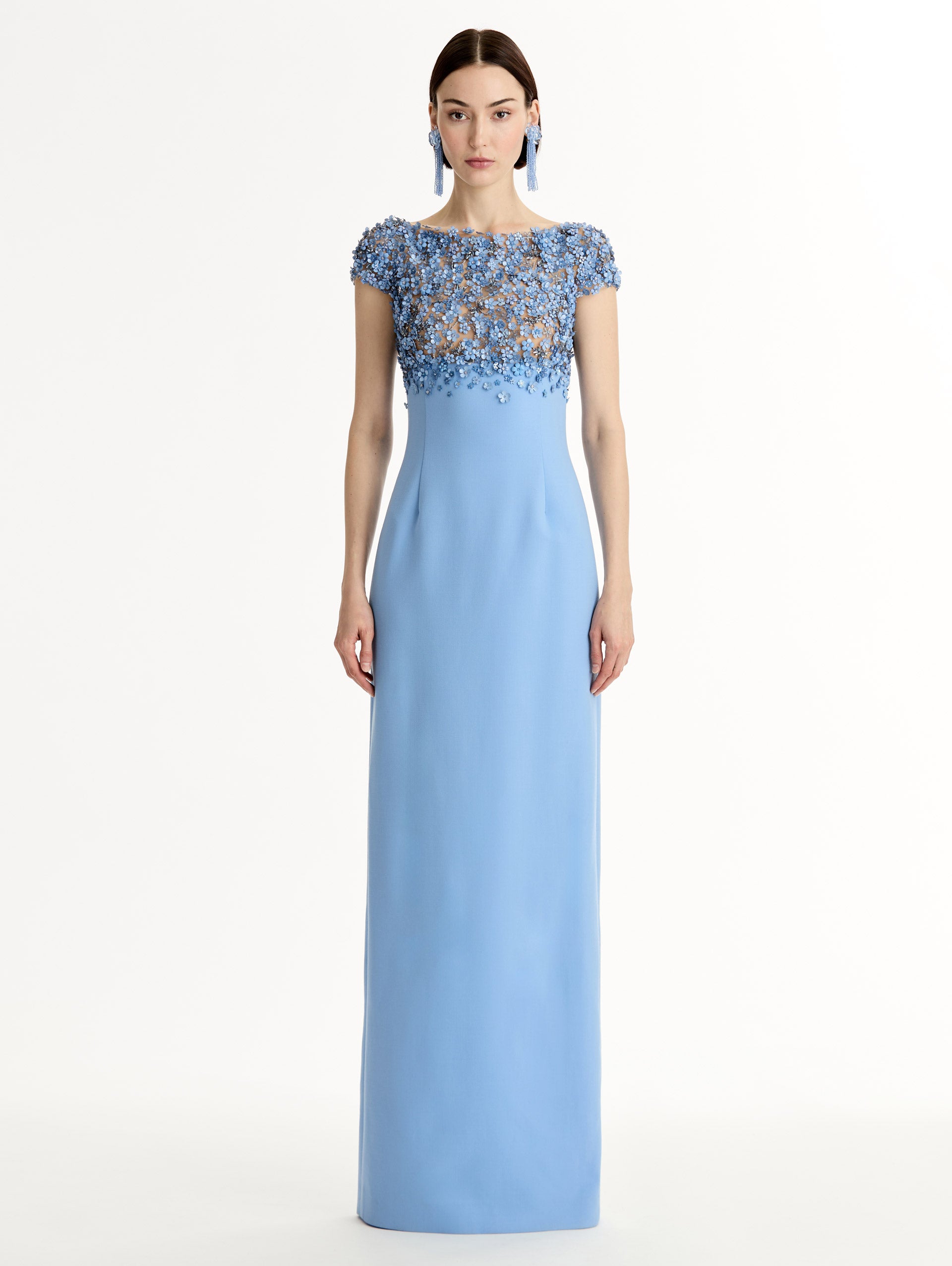 Blue floor length gown with Porcelain-flower motif on cap-sleeve bodice covered in sequins and crystals forming a delicate, petal-like lattice. Double-faced stretch wool skirt. Front View. 