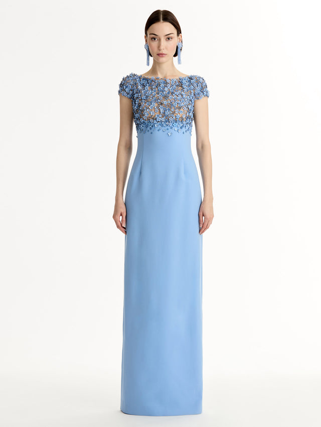 Blue floor length gown with Porcelain-flower motif on cap-sleeve bodice covered in sequins and crystals forming a delicate, petal-like lattice. Double-faced stretch wool skirt. Front View. 