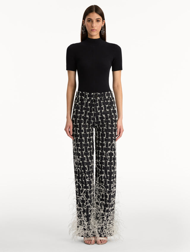 Black and White Woven Denim Jacquard Pant with feather detailing. Front View.