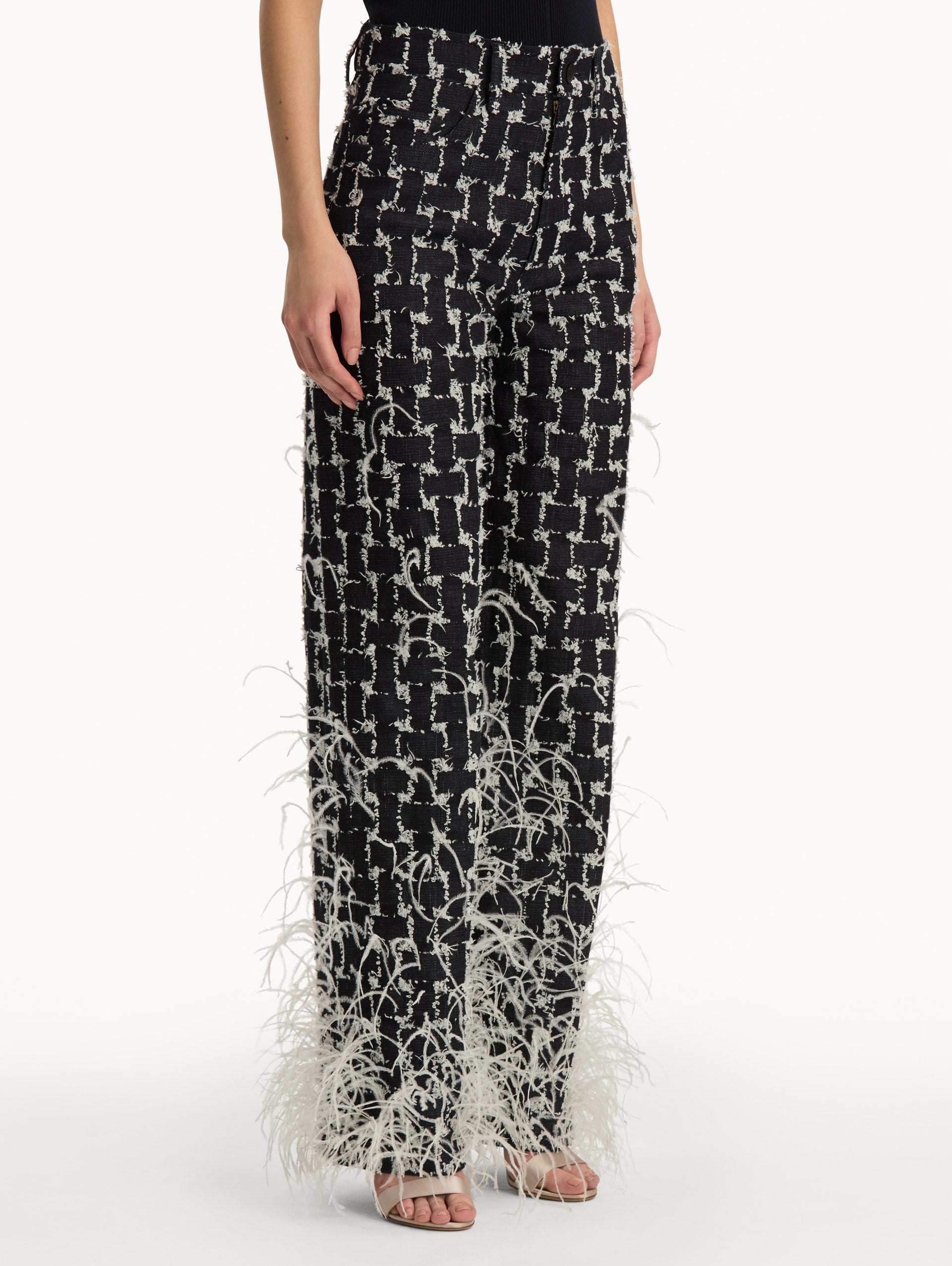 Black and White Woven Denim Jacquard Pant with feather detailing. Side View.