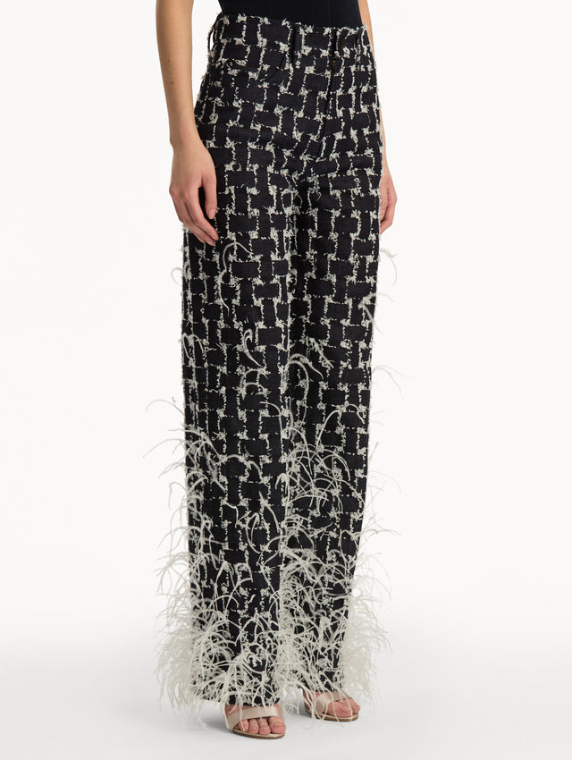 Black and White Woven Denim Jacquard Pant with feather detailing. Side View.