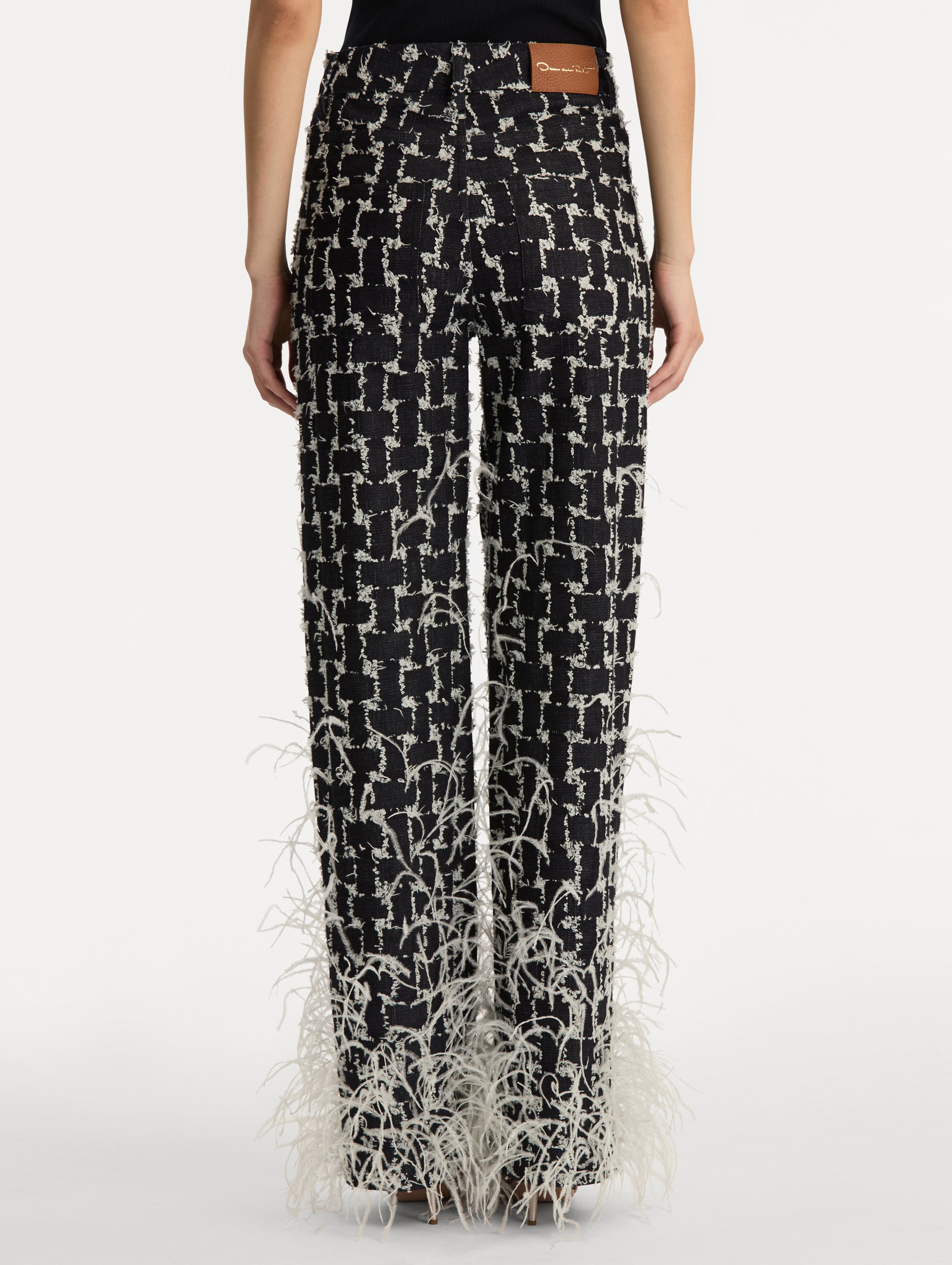 Black and White Woven Denim Jacquard Pant with feather detailing. Back View.