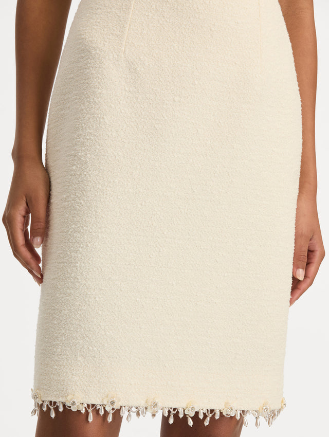 White Floral Jeweled Fringe Tweed Skirt featuring a fitted silhouette with jeweled applique along hem. Zoom View.