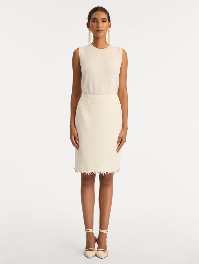 White Floral Jeweled Fringe Tweed Skirt featuring a fitted silhouette with jeweled applique along hem. Front View.