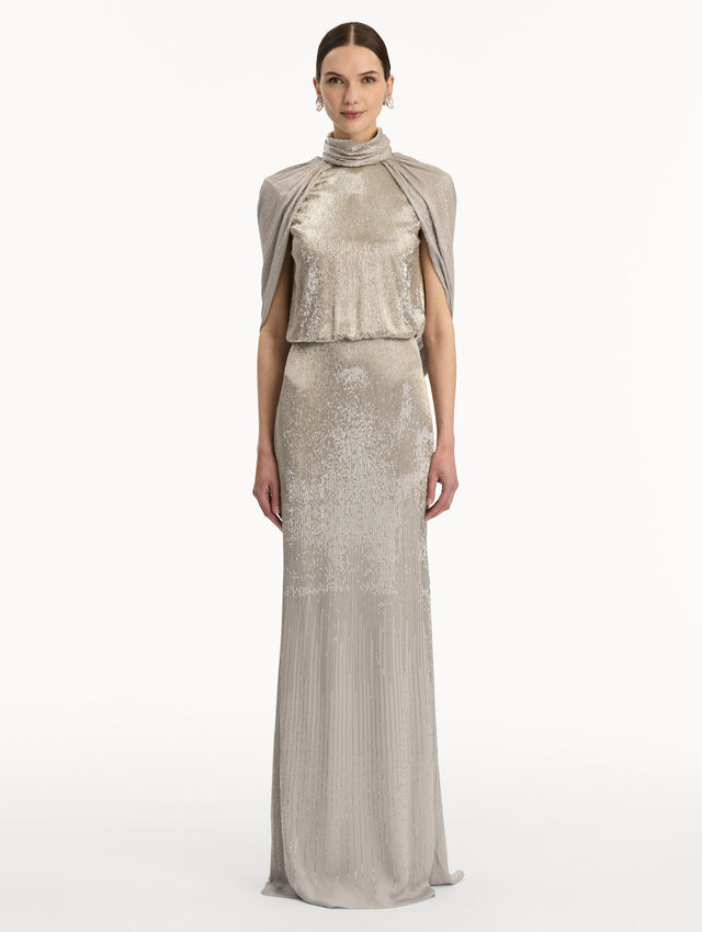Silver Bugle Bead Lamé Draped Gown with a high neckline, draped cape sleeves, and metallic finish. Front View.