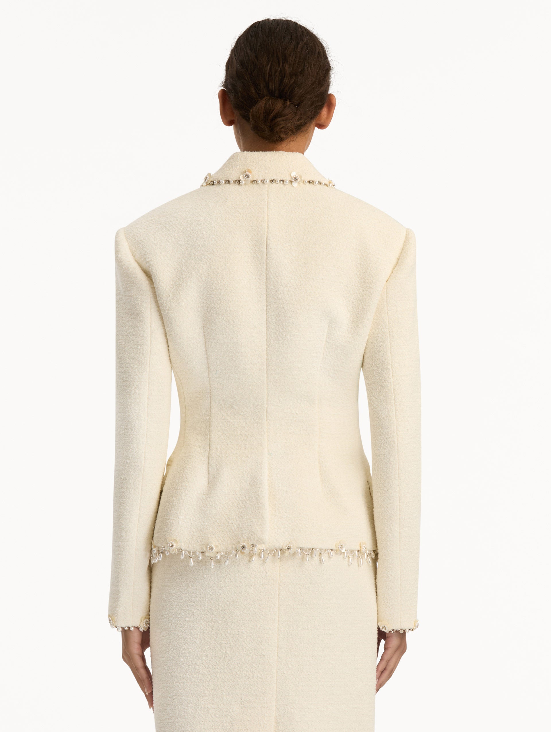 White Floral Jeweled Fringe Tweed Jacket featuring a fitted silhouette with jeweled applique along hems. Back View.