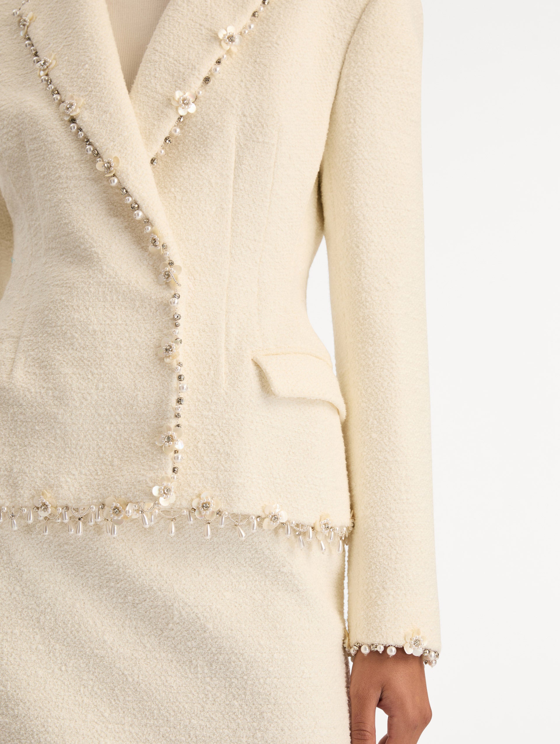White Floral Jeweled Fringe Tweed Jacket featuring a fitted silhouette with jeweled applique along hems. Zoom View.