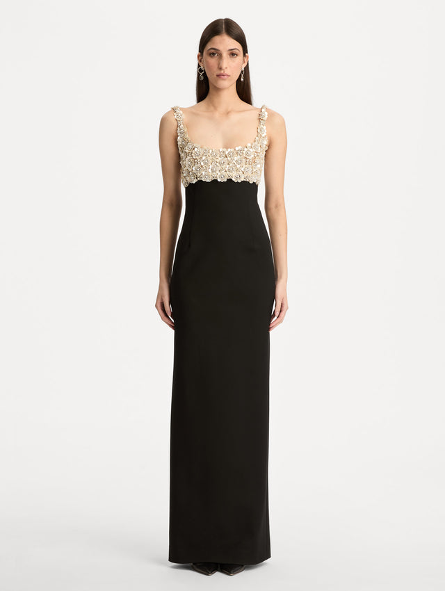 Black Mother of Pearl Embroidered Sleeveless Gown with a form fitting, floor length silhouette and an embellished bodice. Front View.