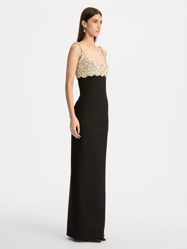 Black Mother of Pearl Embroidered Sleeveless Gown with a form fitting, floor length silhouette and an embellished bodice. Side View.