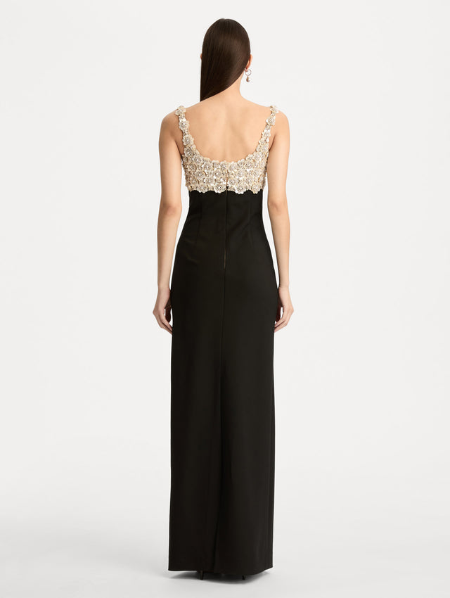 Black Mother of Pearl Embroidered Sleeveless Gown with a form fitting, floor length silhouette and an embellished bodice. Back View.