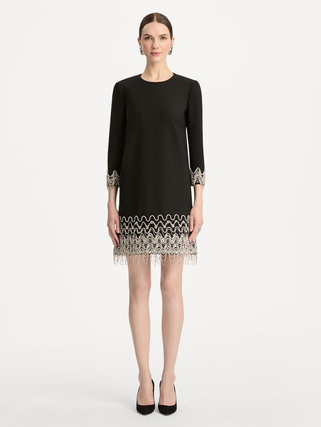 Black Crystal Wave Embroidered Shift Dress with long sleeves and beaded embellishments along the hemline and sleeve cuffs. Front View.