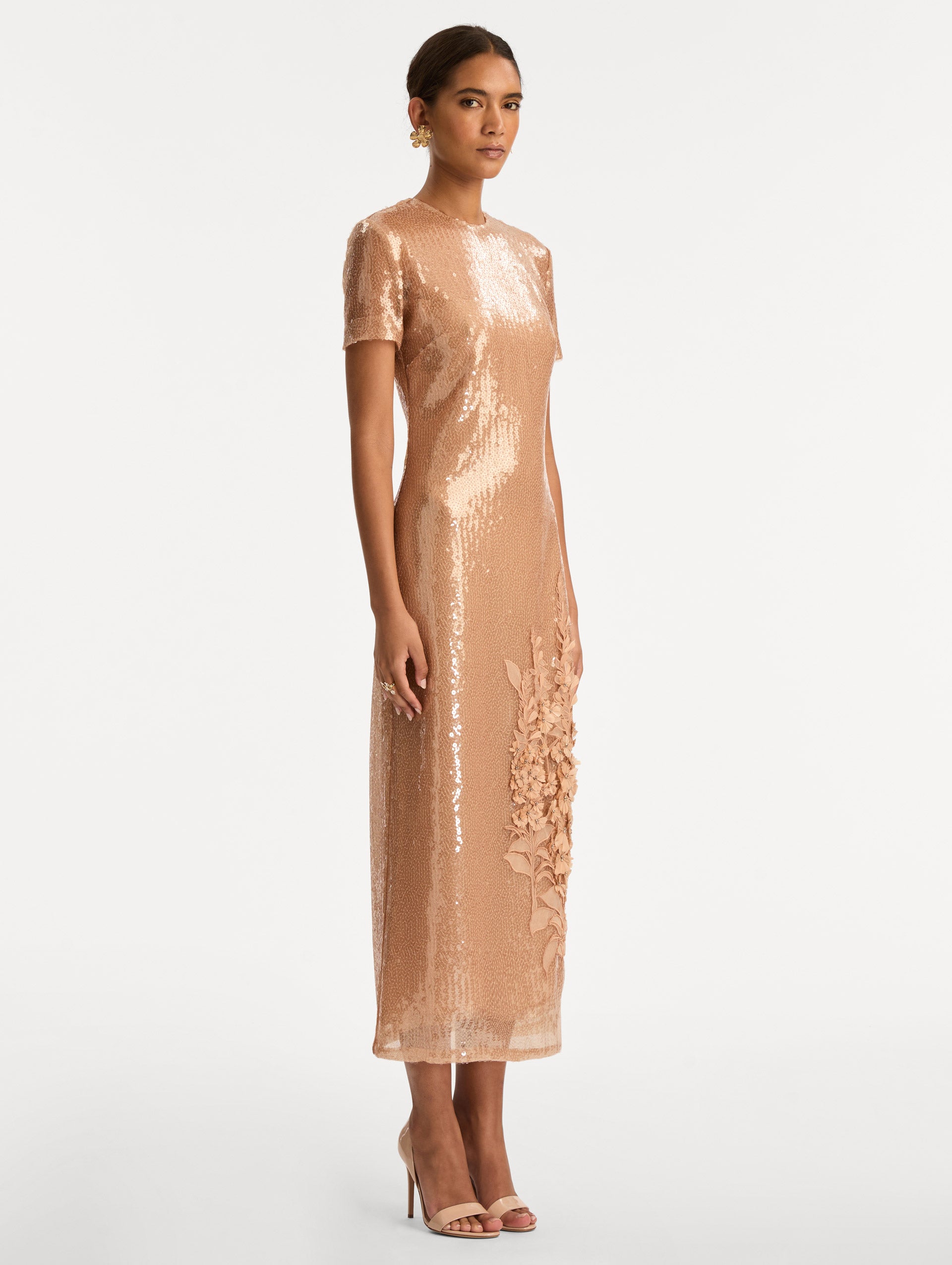 Rose Gold Foxglove Embroidered Sequin Tulle Dress with short sleeves and tonal floral appliqué detail near the hem. Side View.