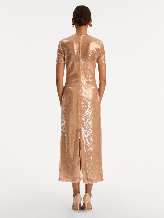 Rose Gold Foxglove Embroidered Sequin Tulle Dress with short sleeves and tonal floral appliqué detail near the hem. Back View.