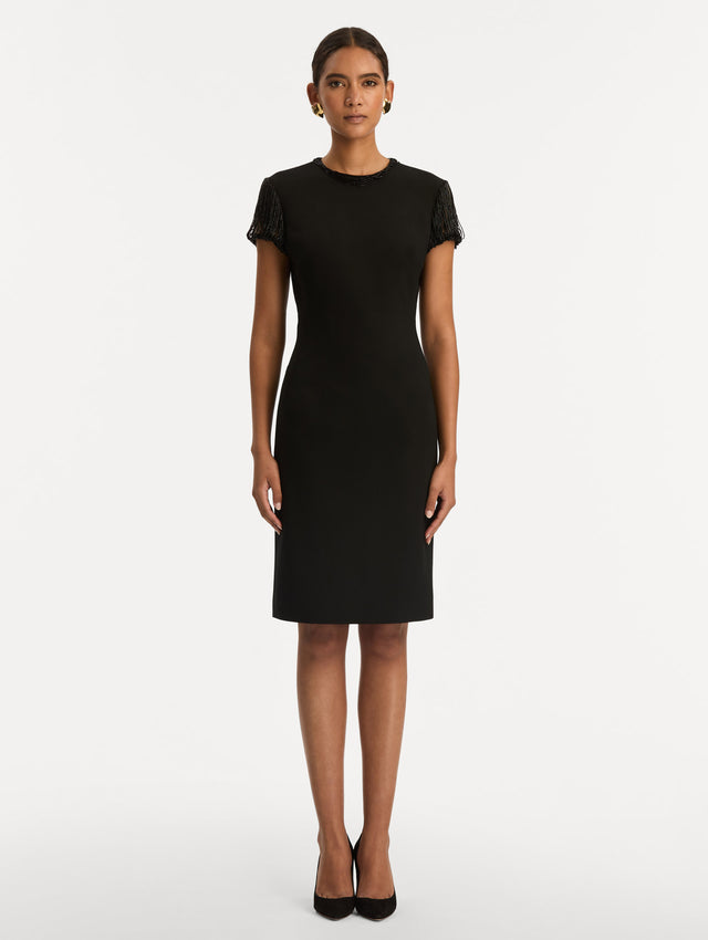 Black Bugle Bead Embroidered Cocktail Dress with beaded sleeves and a slim silhouette. Front View. 