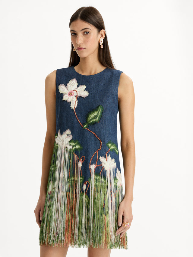 Denim, mini shift dress with Chiné Cyclamen motif and cascading threadwork fringe. Sleeveless. Front View.