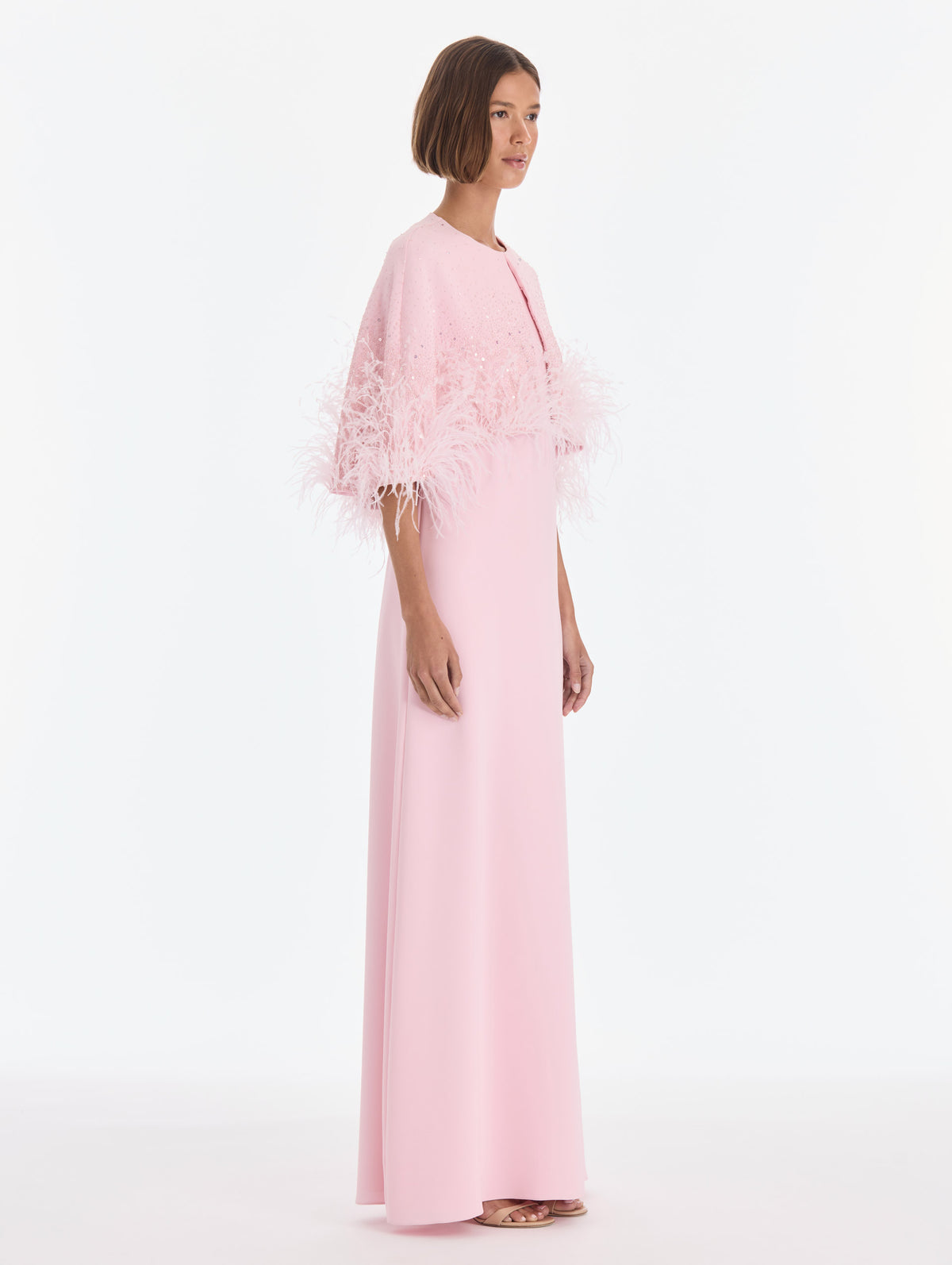 The model is wearing a cape mixed beaded embroidered caftan. Zoom view.