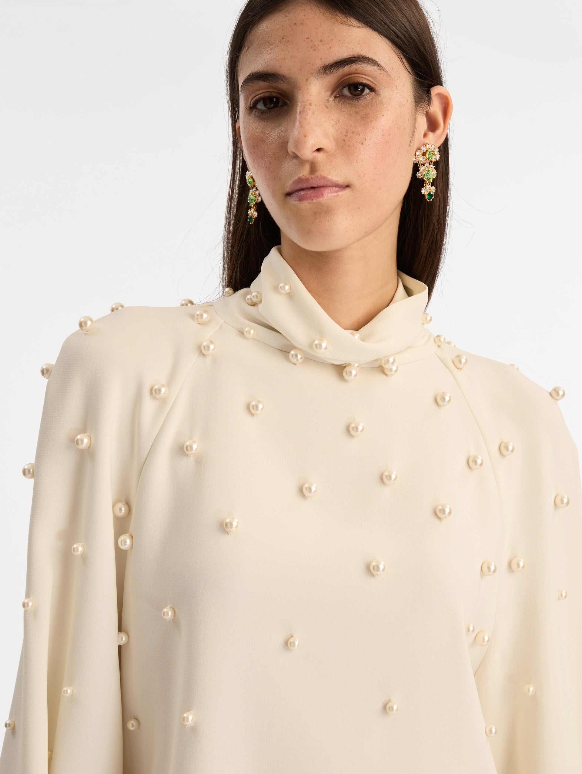 Ivory Pearl Cluster Georgette Blouse with long puff sleeves, a high neck, and pearl embellishments throughout. Zoom View.