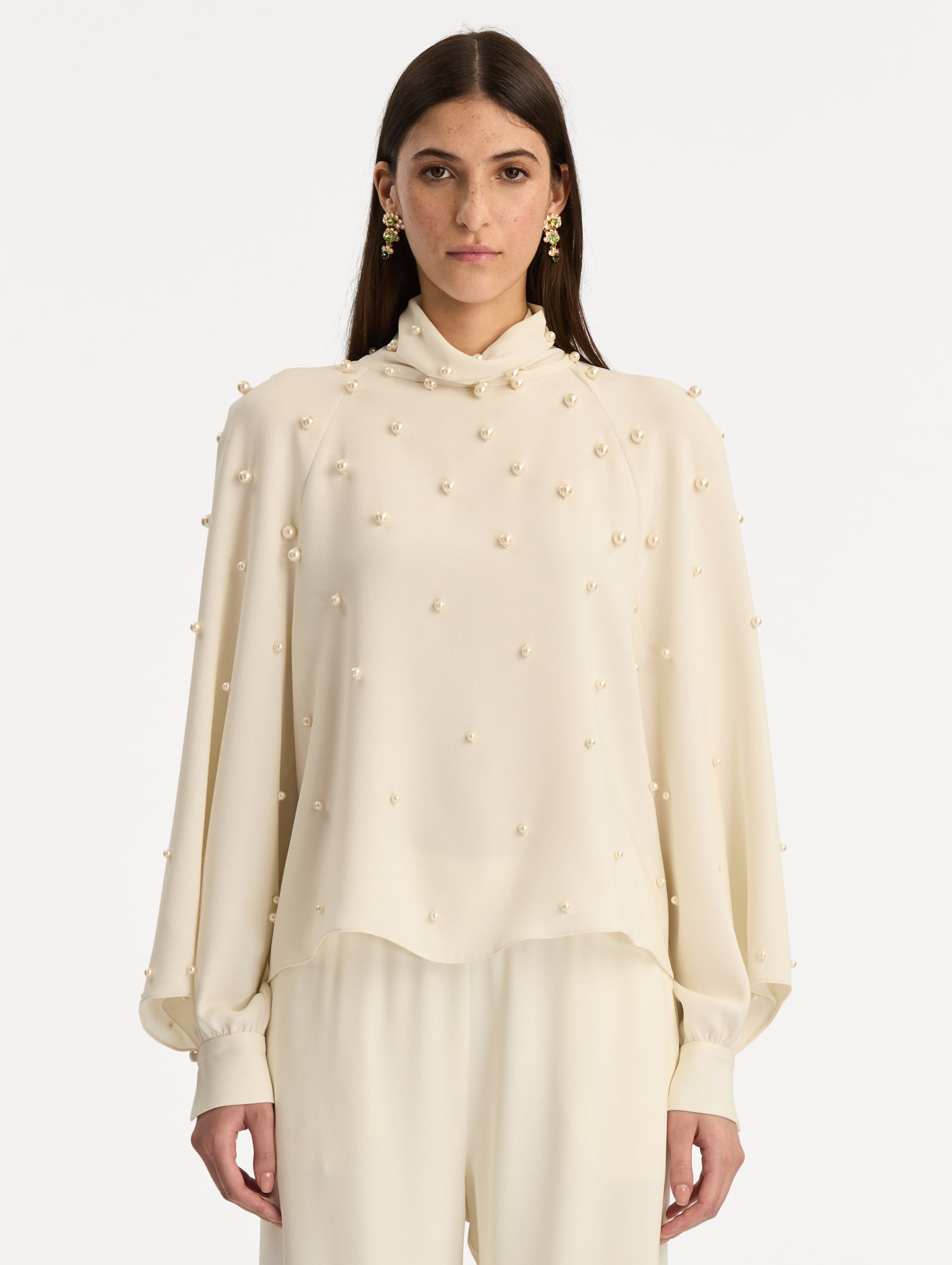 Ivory Pearl Cluster Georgette Blouse with long puff sleeves, a high neck, and pearl embellishments throughout. Front View.