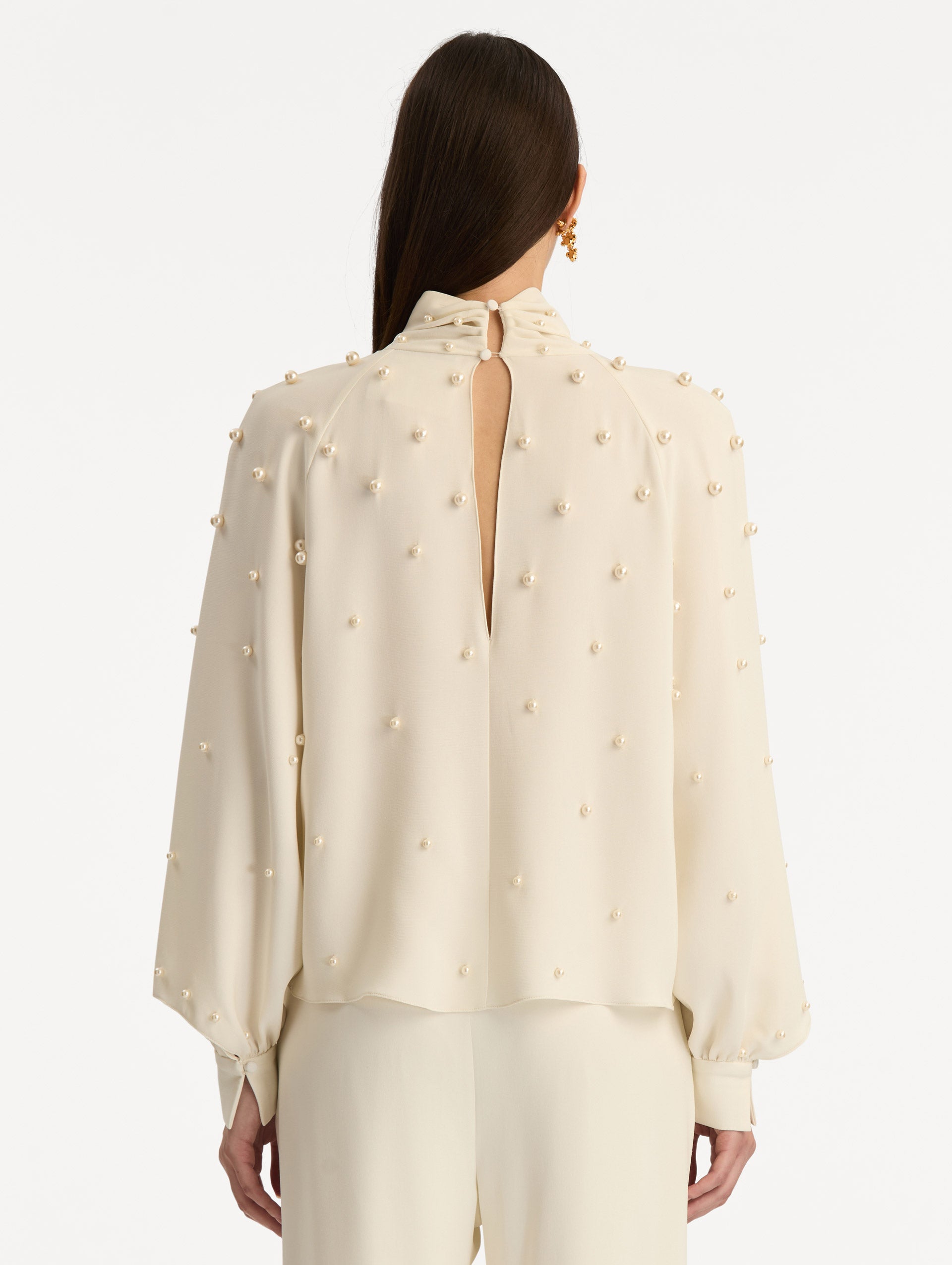 Ivory Pearl Cluster Georgette Blouse with long puff sleeves, a high neck, and pearl embellishments throughout. Back View.