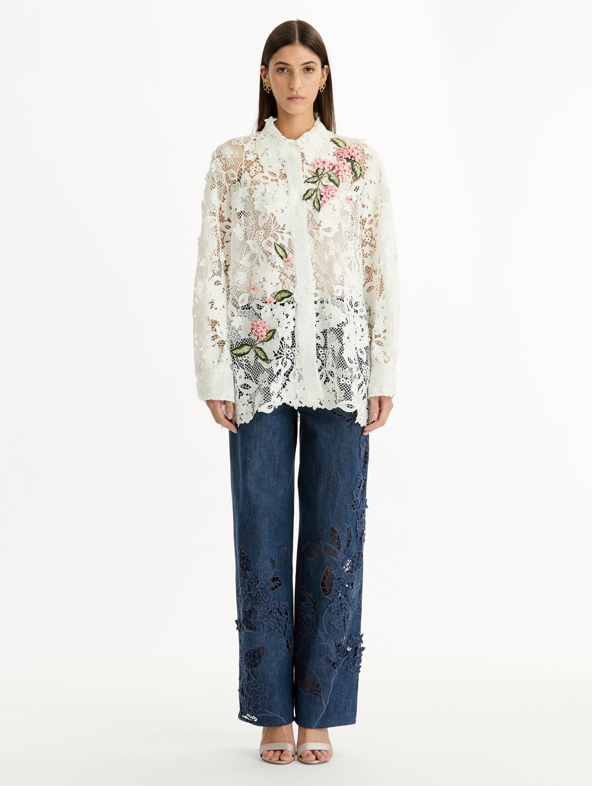 Long Sleeve, Button Up Blouse with Delicate guipure lace and intricate porcelain flower embroidery. White with pink florals. Front View.