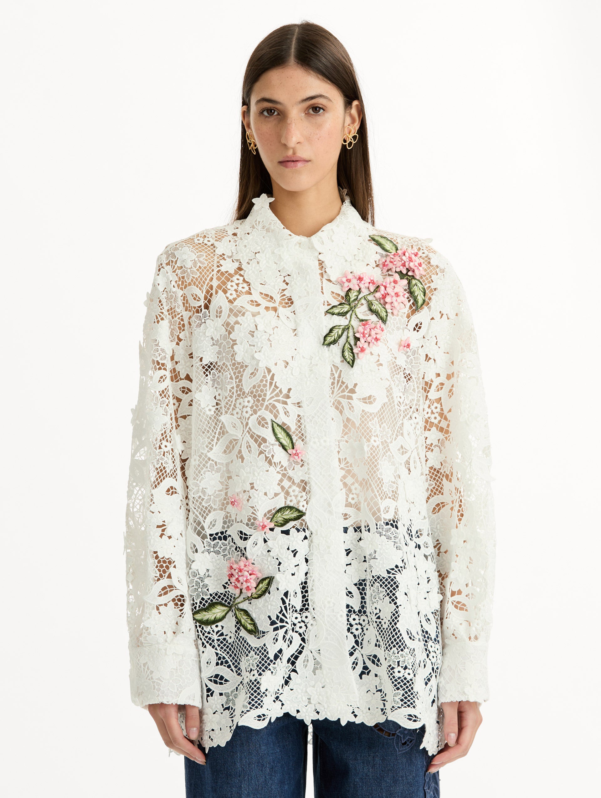 Long Sleeve, Button Up Blouse with Delicate guipure lace and intricate porcelain flower embroidery. White with pink florals. Front View.