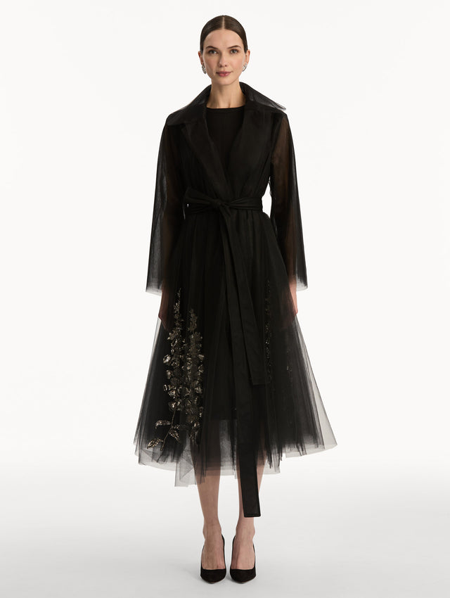 Black Foxglove Sequin Embroidered Opera Coat featuring a belted waist, wide collar, and embroidered floral detailing over a midi-length silhouette. Front View.