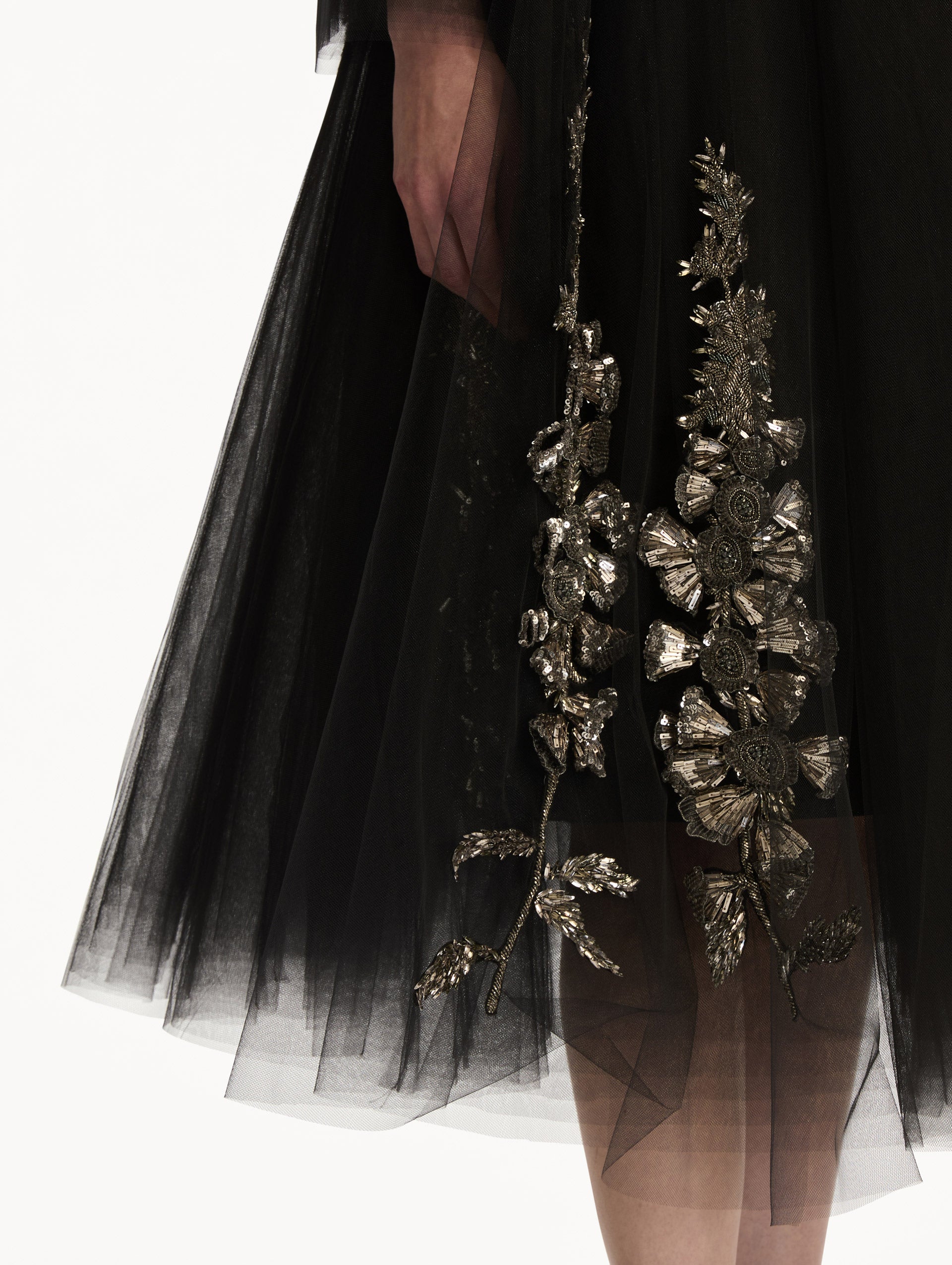 Black Foxglove Sequin Embroidered Opera Coat featuring a belted waist, wide collar, and embroidered floral detailing over a midi-length silhouette. Zoom View.