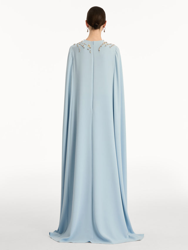 Light Blue Crystal Necklace Embroidered Caftan featuring a floor-length silhouette with draped sleeves and crystal embellishment along the neckline. Back View.