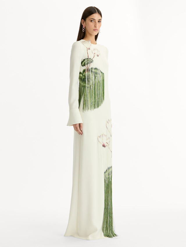 Ivory, long sleeve, floor length, heavy silk stretch georgette gown with Chiné Cyclamen motif in threadwork fringe. Side View.