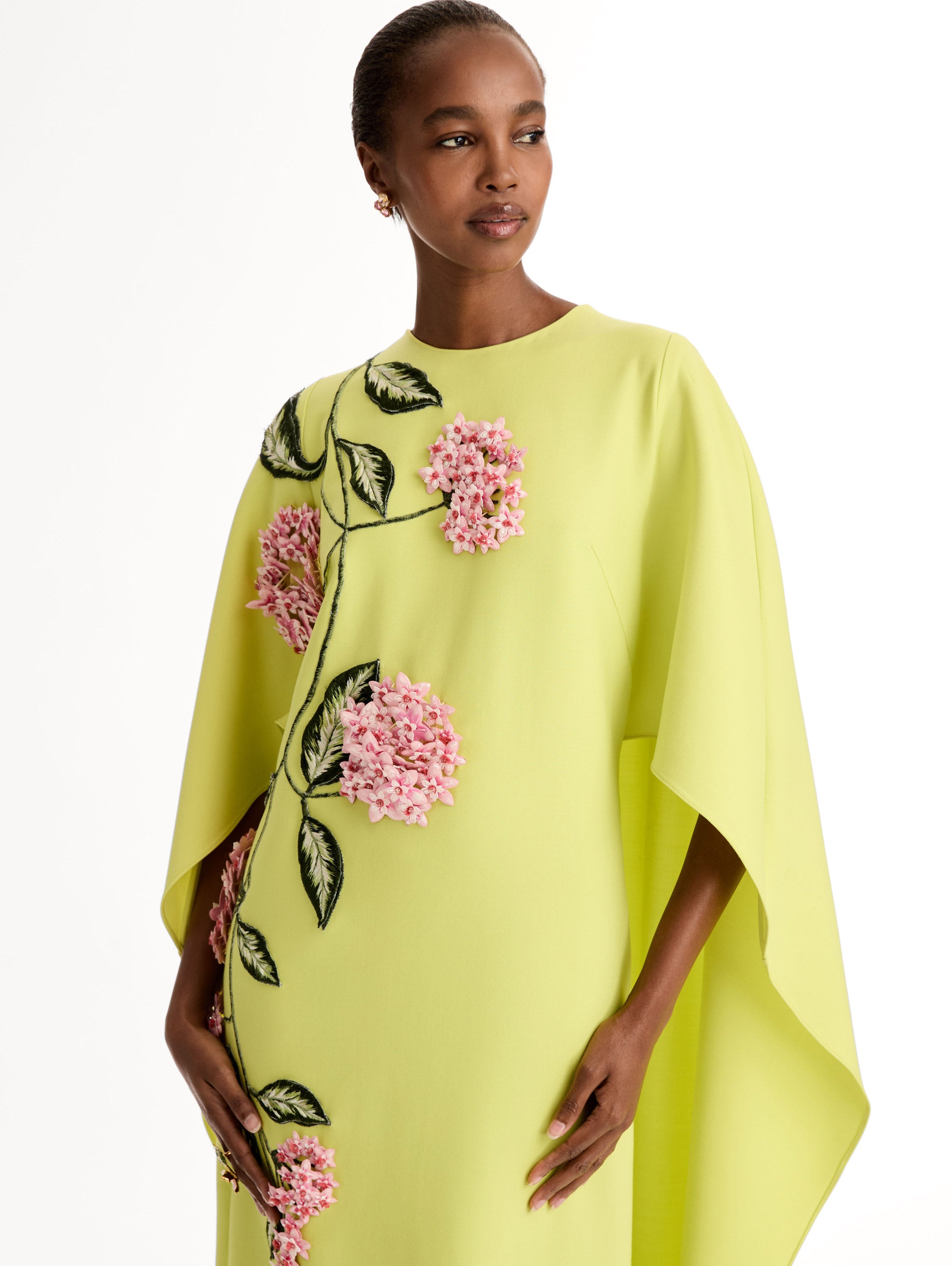  Caftan in double-faced stretch wool, with porcelain-flower threadwork and three-dimensional blossoms. Front View, Close Up. 