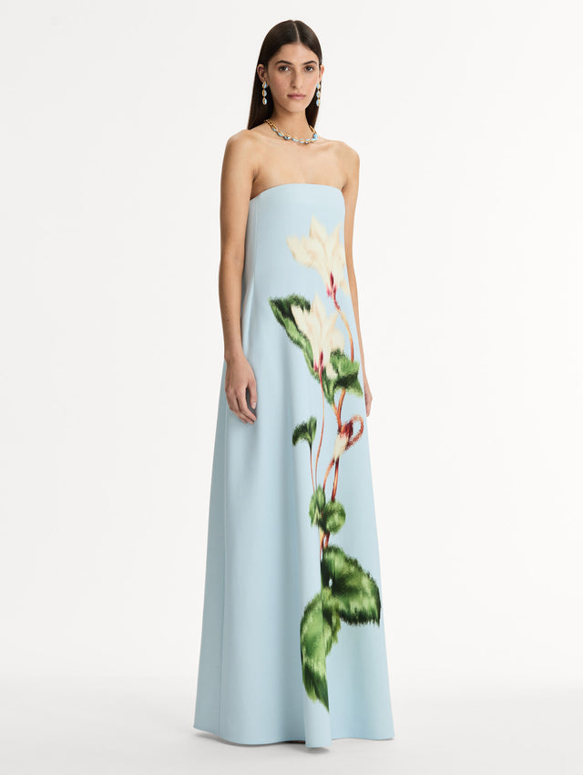 Strapless Floor Length Gown in Pale Blue with trapeze silhouette. Chiné Cyclamen motif blooms with blurred edges. Side View. 