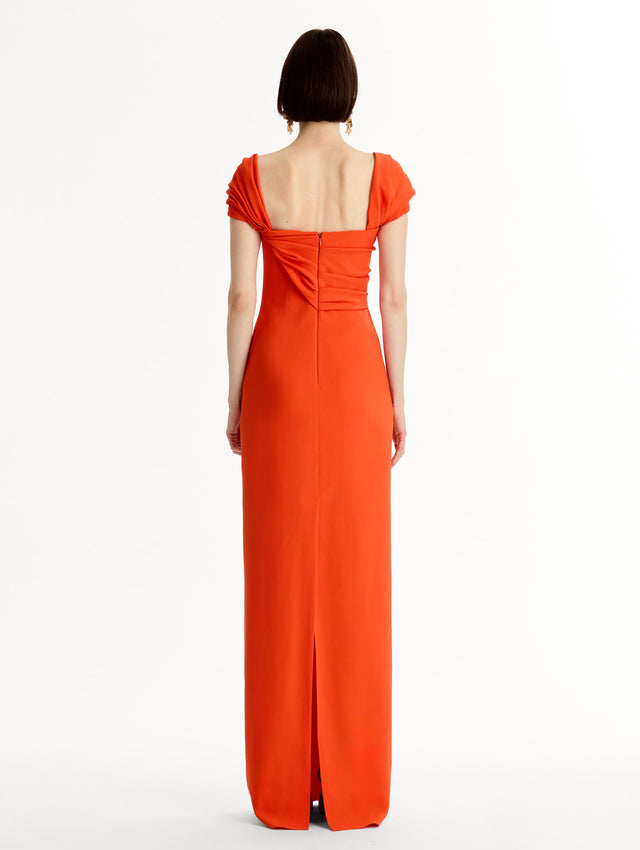 Fluid stretch cady gown with sculptural draping along neckline and shoulders. Short sleeve, column silhouette . Back View. 