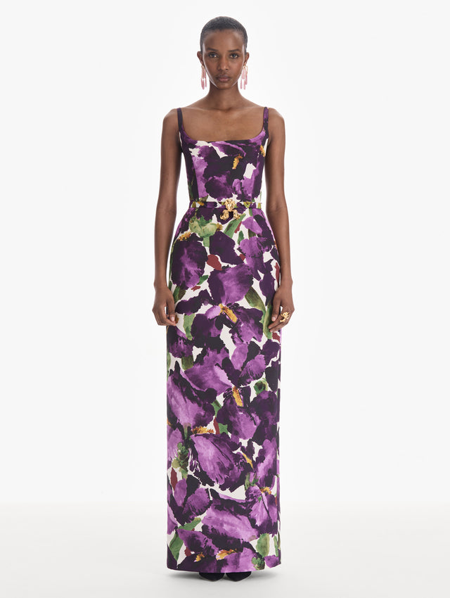 The model is wearing a sleeveless large watercolor iris faille gown. Front view.