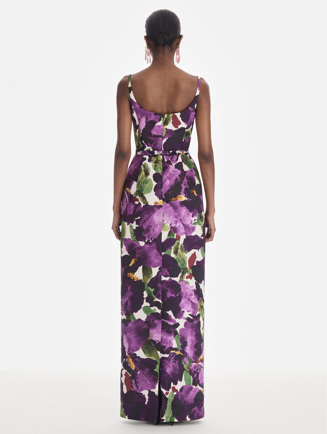 The model is wearing a sleeveless large watercolor iris faille gown. Back view.