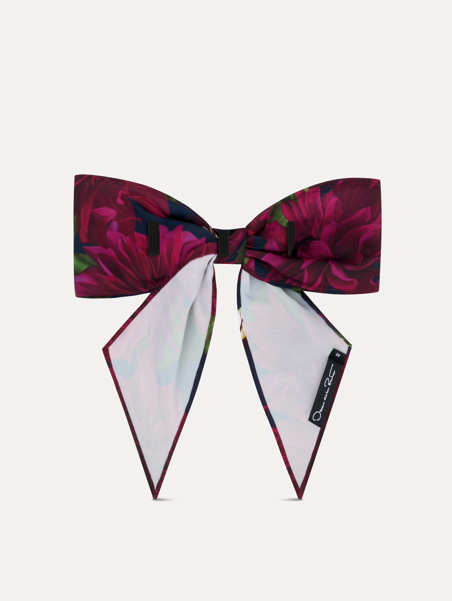 Purple and navy floral ODLR x @SimonSits Dahlia Dog Bow featuring an oversized shape and long pointed tails. Back View.
