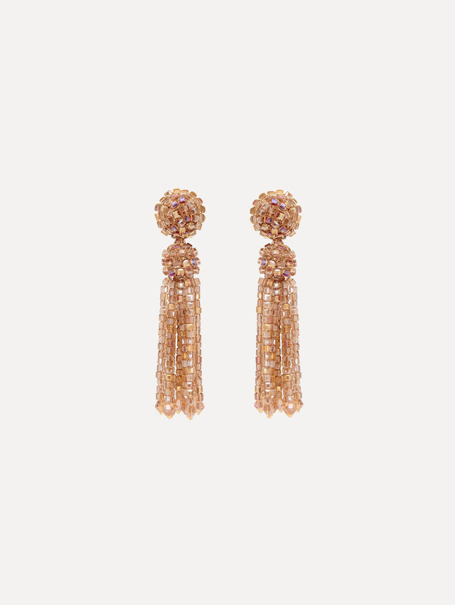 tassel earrings cascade in sculptural strands, each crystal carefully strung to catch the light. Finished with crystal-strung post.