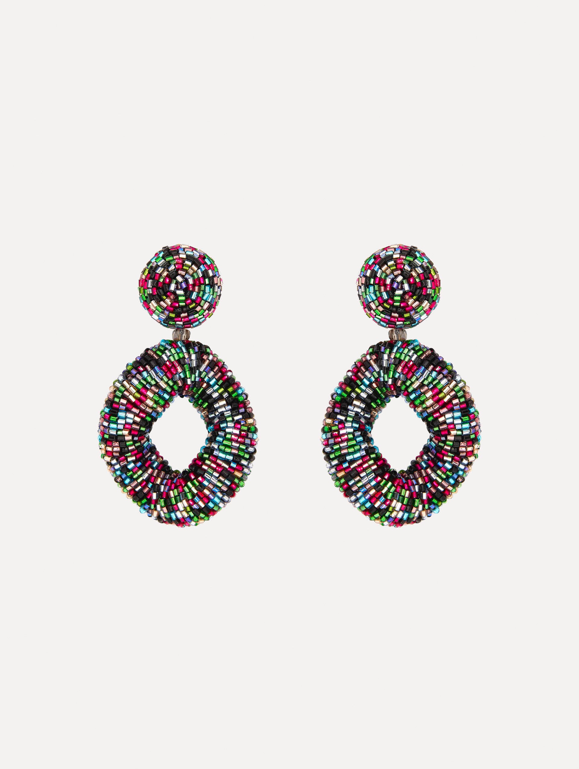 Hand-beaded earrings feature jet-black bugle beads in a bold, open-loop silhouette. 