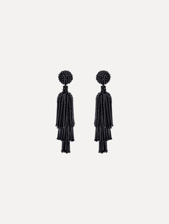 Tiered tassel earrings are crafted from black beads arranged in cascading columns.