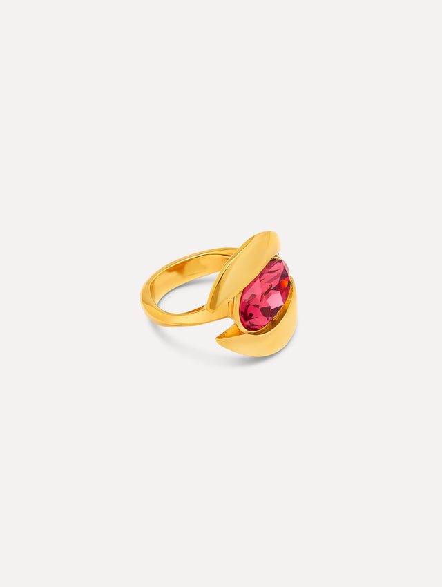 Side view of a ring which frames a oval-cut stone in a curved setting. The polished gold-tone finish contrasts with the hue of the central gemstone. 