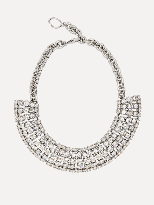 Necklace with a fan of crystals, arranged in structured rows that create a sculptural silhouette. Anchored by a bold chain.