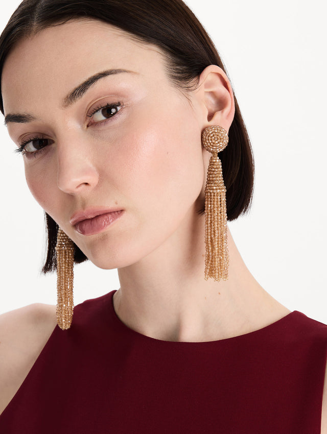 The Conical Tassel Clip-On Earrings in Champagne. Front view.