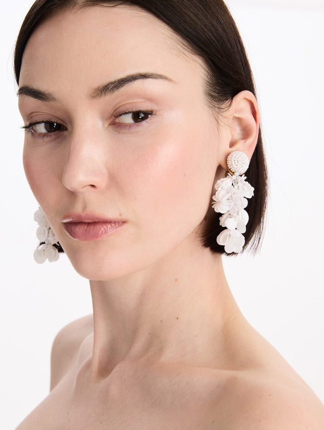 The Beaded Floral Bouquet Clip-On Earrings in White. Front view.