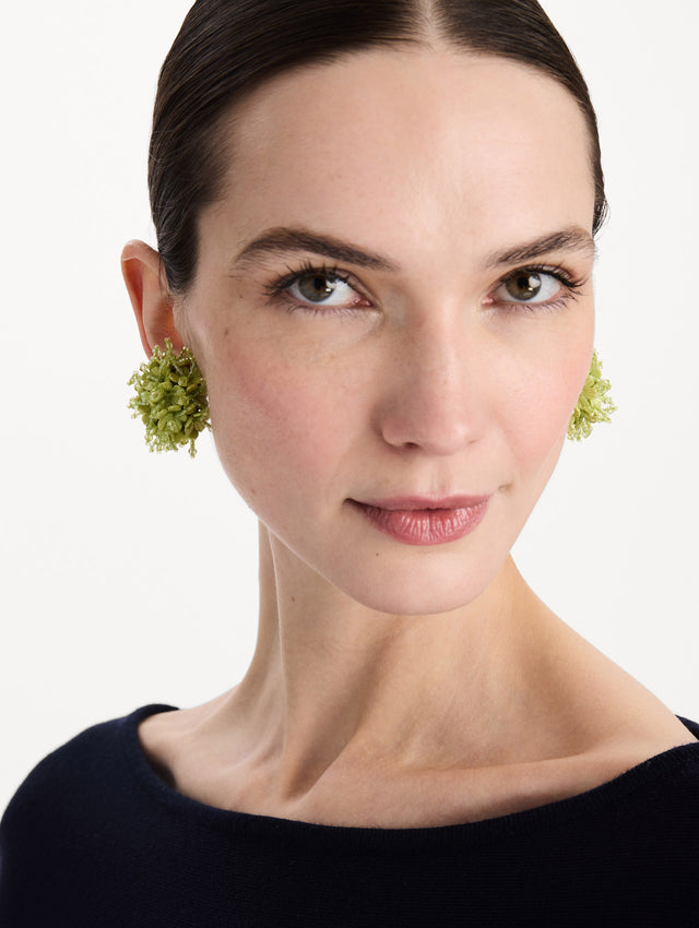 The Firework Clip-On Earrings in Green. Front view.