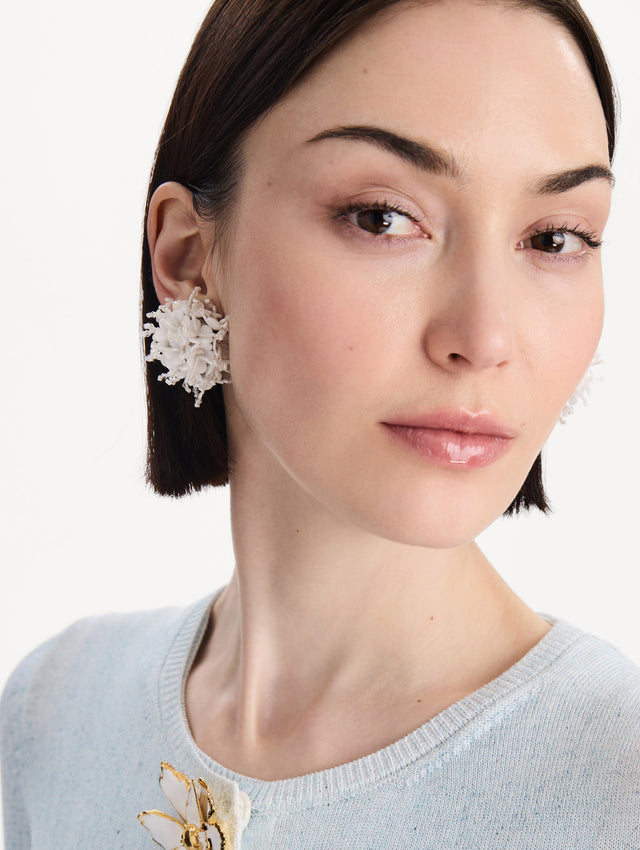 The Firework Clip-On Earrings in White. Front view.