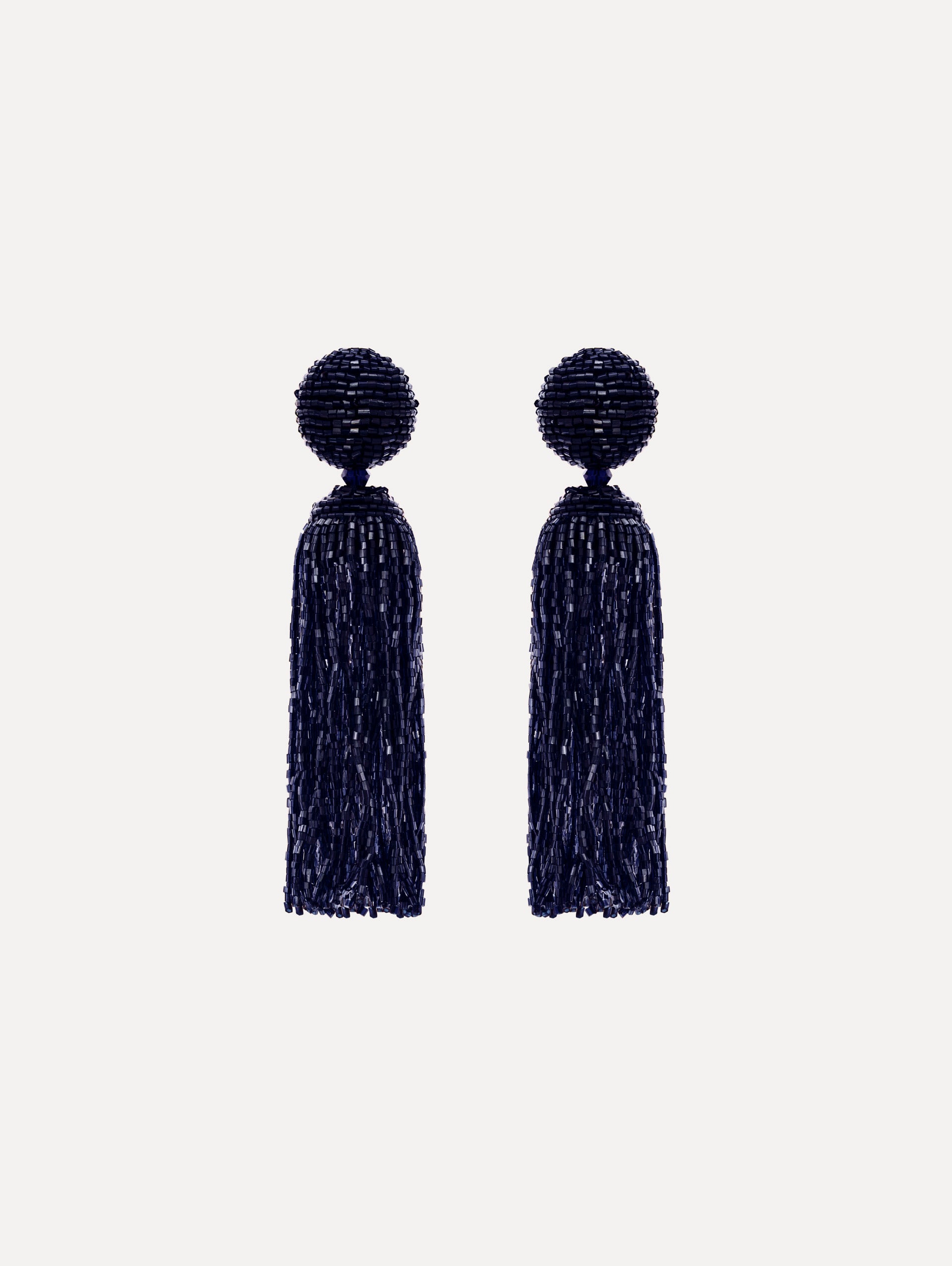 The Metallic Beaded Tassel Clip-On Earrings in Navy. 