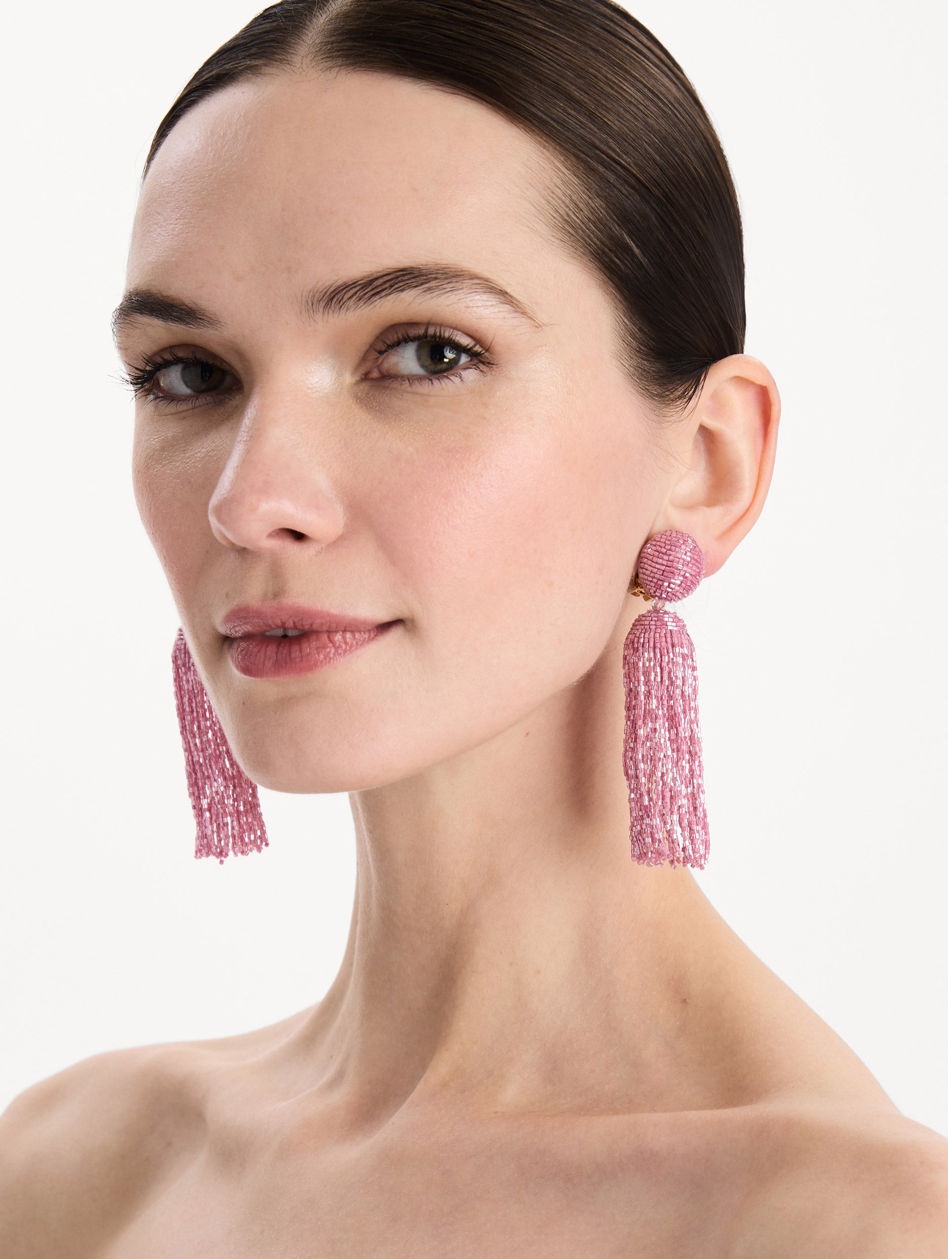 The Metallic Beaded Tassel Clip-On Earrings in Pink. Front view.