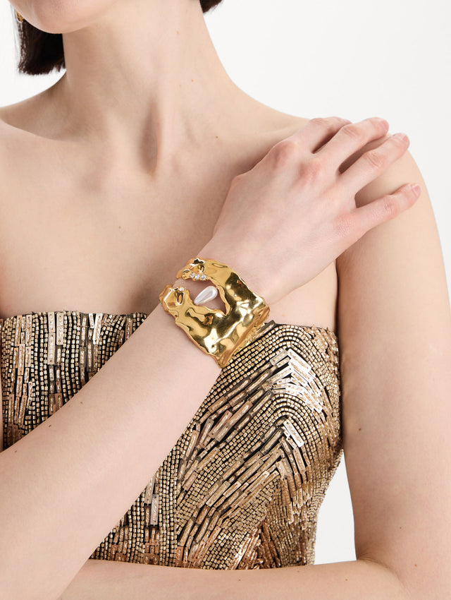 The Hammered Pearl Cuff Bracelet in pearl. Model view
