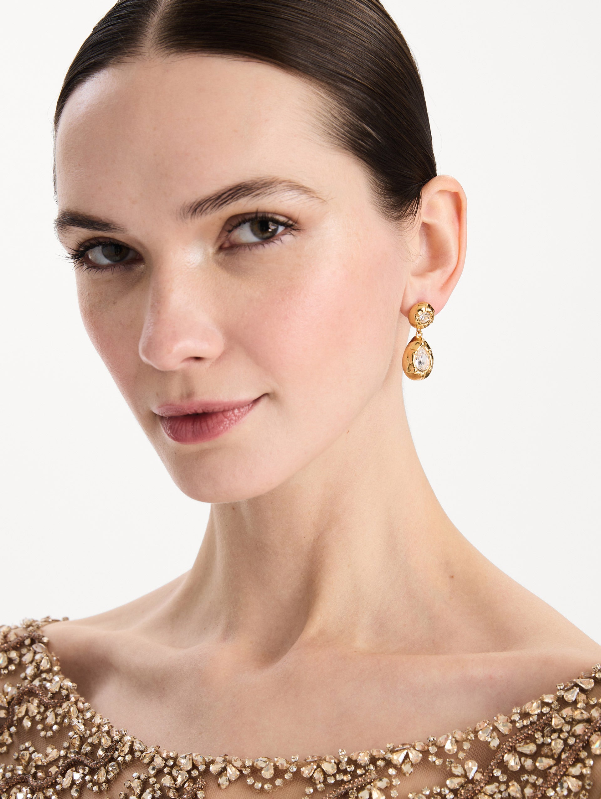 The Scramble Drop Earrings in Crystal. Front view.