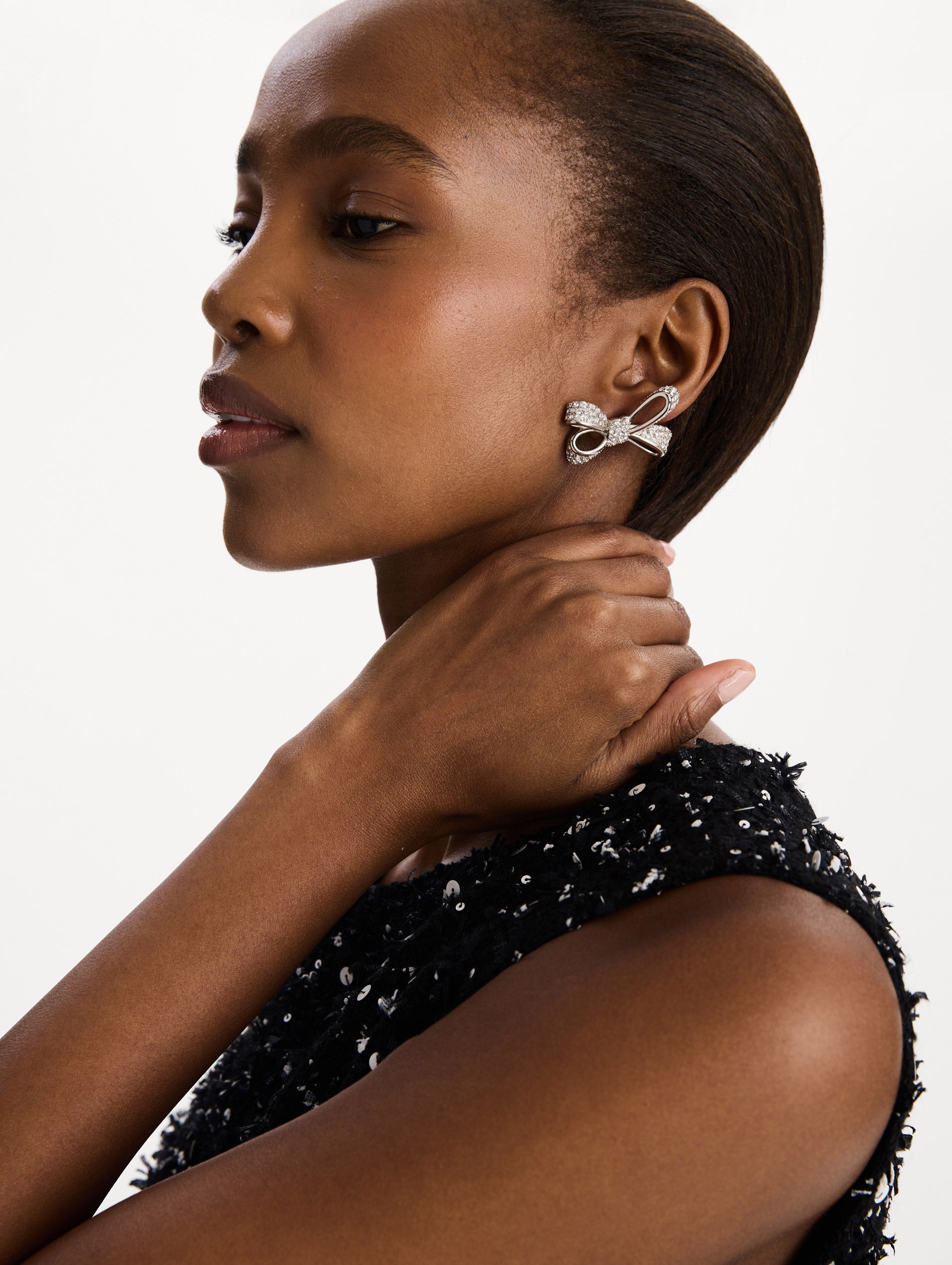 The Crystal Pavé Bow Earrings in Silver. Front view.